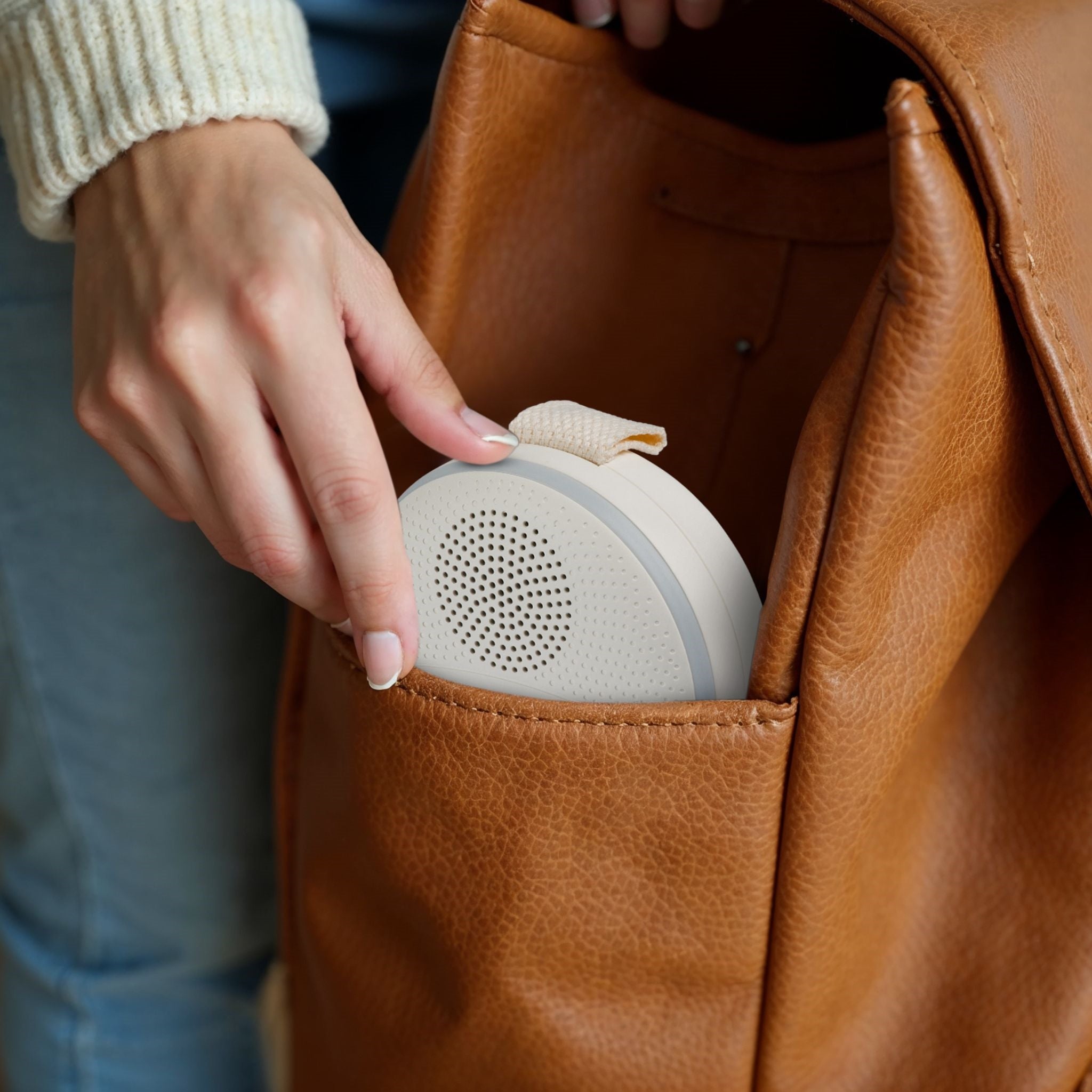Portable white noise machine and night light displaying soft ambient glow