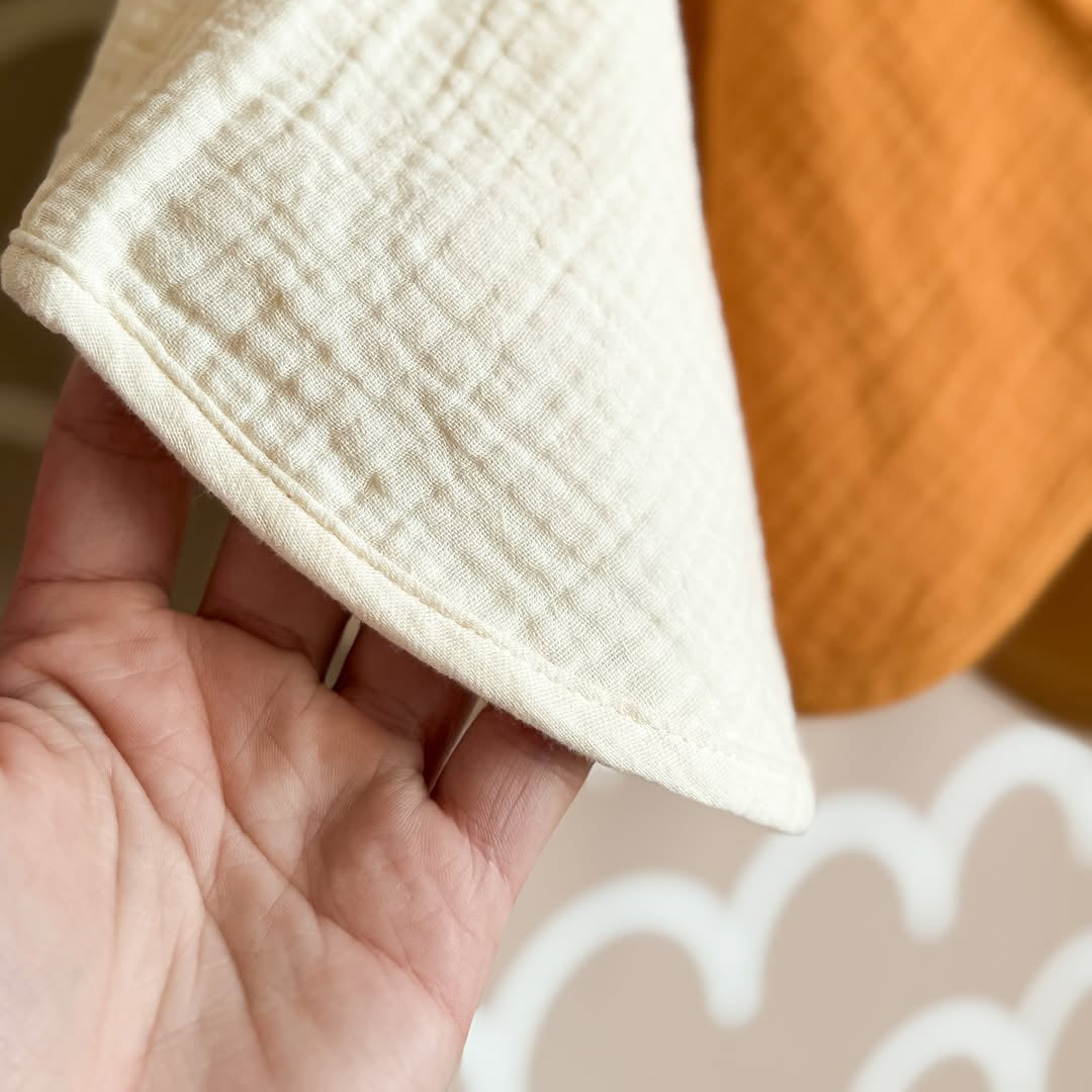 Organic muslin burp cloth in golden harvest color folded display