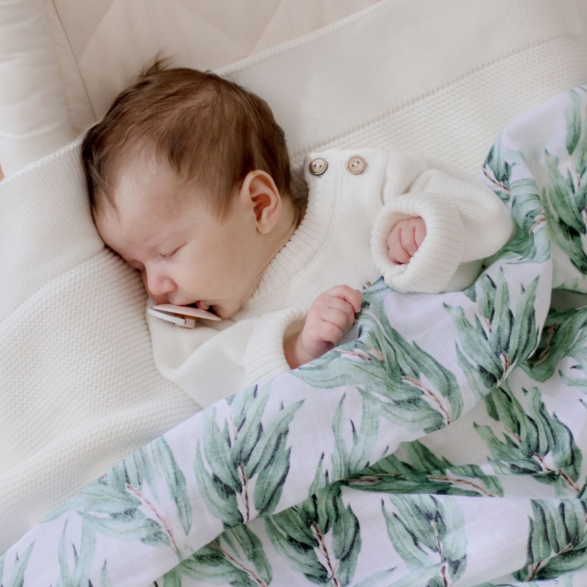 Soft organic cotton muslin swaddle wrap in blue gum leaf print for babies