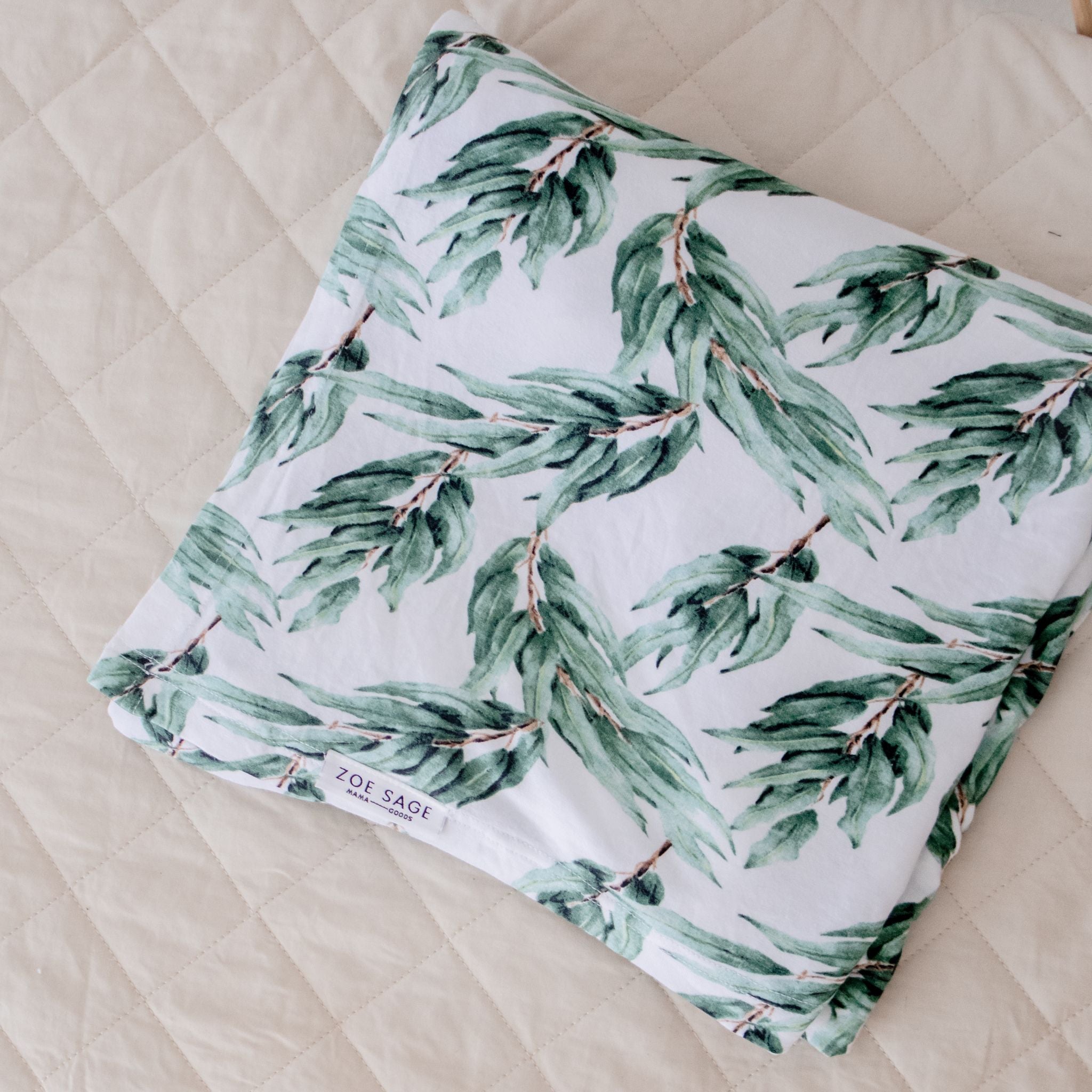 Blue gum leaf stretchy baby swaddle wrap folded neatly