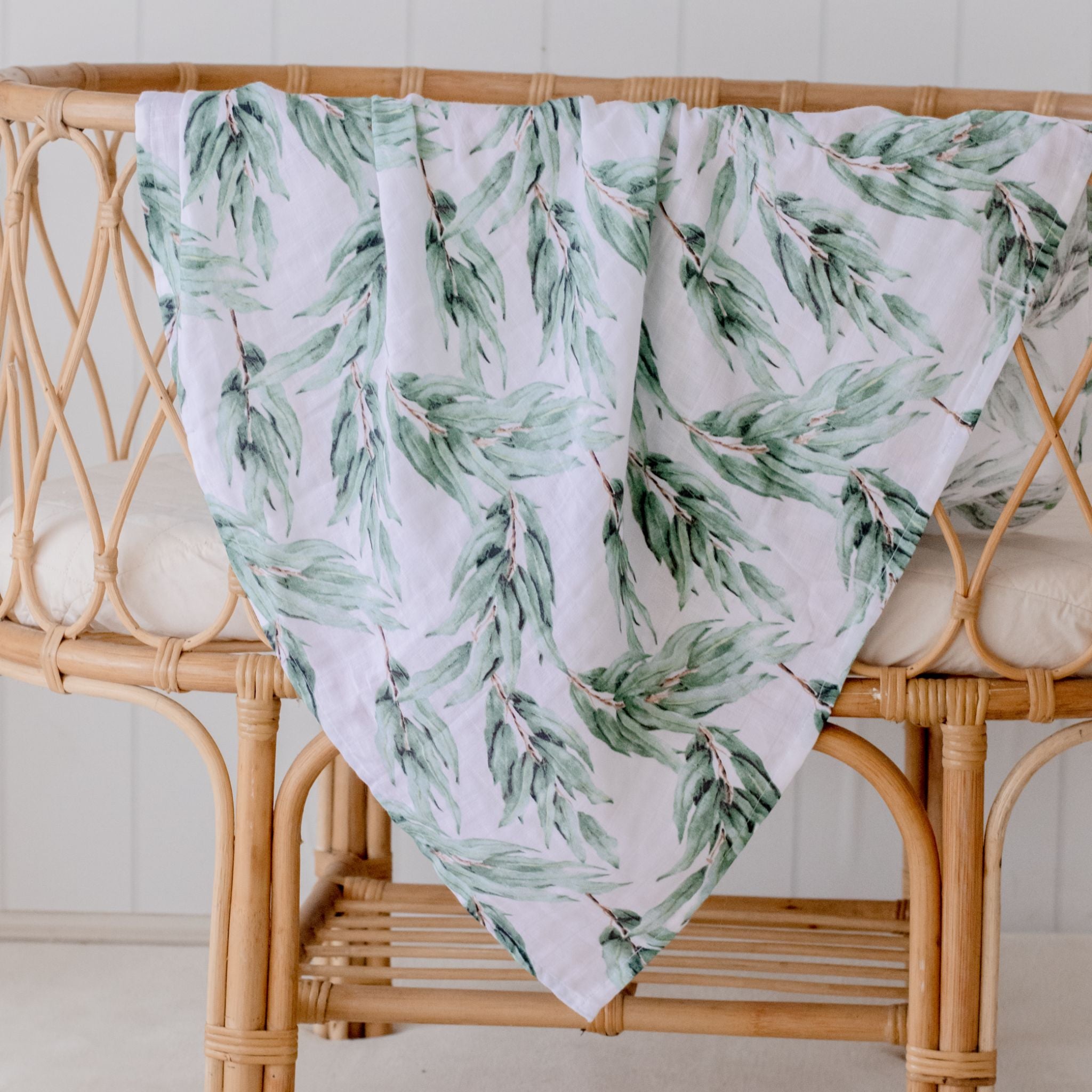 Organic cotton muslin swaddle wrap in soft blue gum leaf color for babies