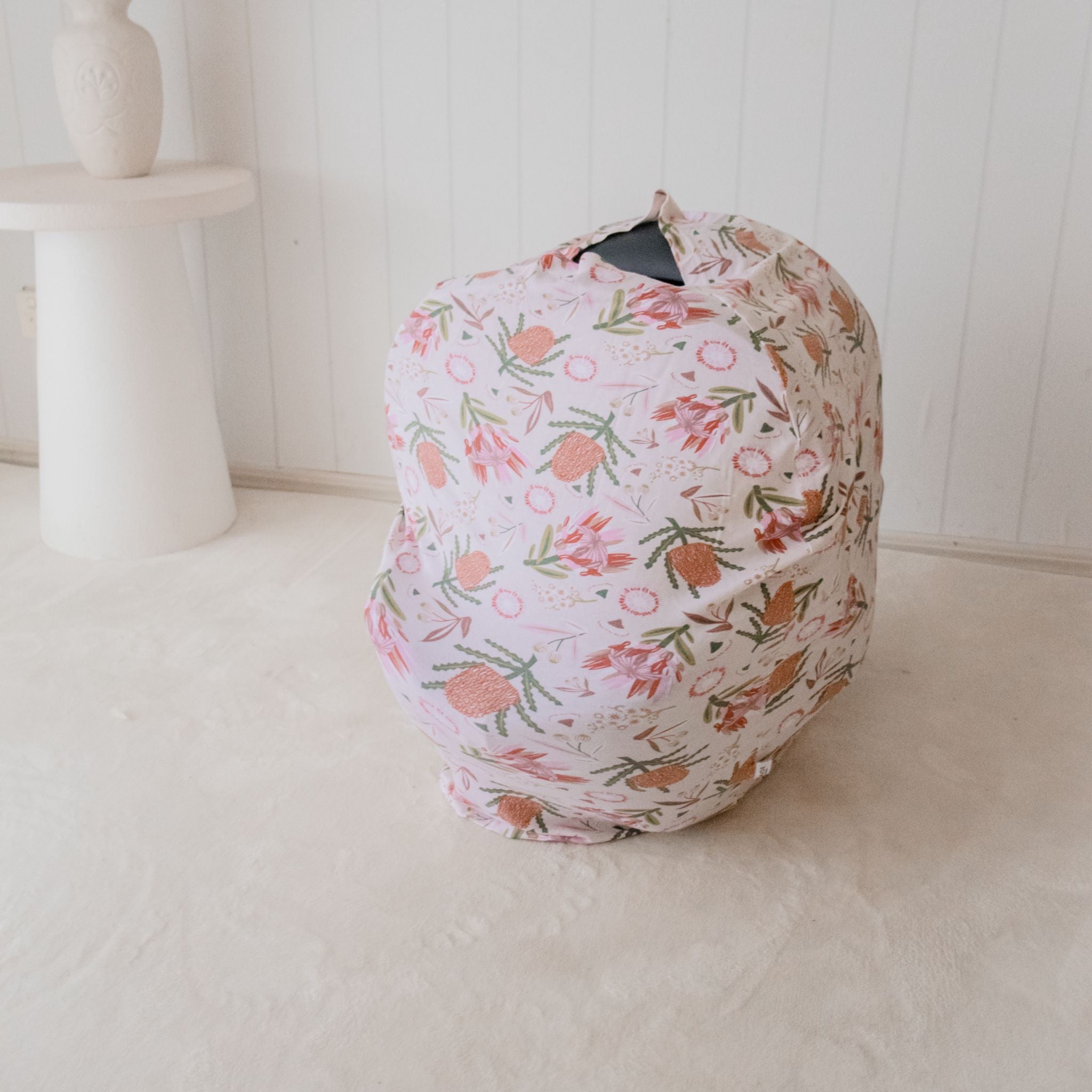 Gumnut Blossoms nursing cover draped over shoulder in soft fabric detail
