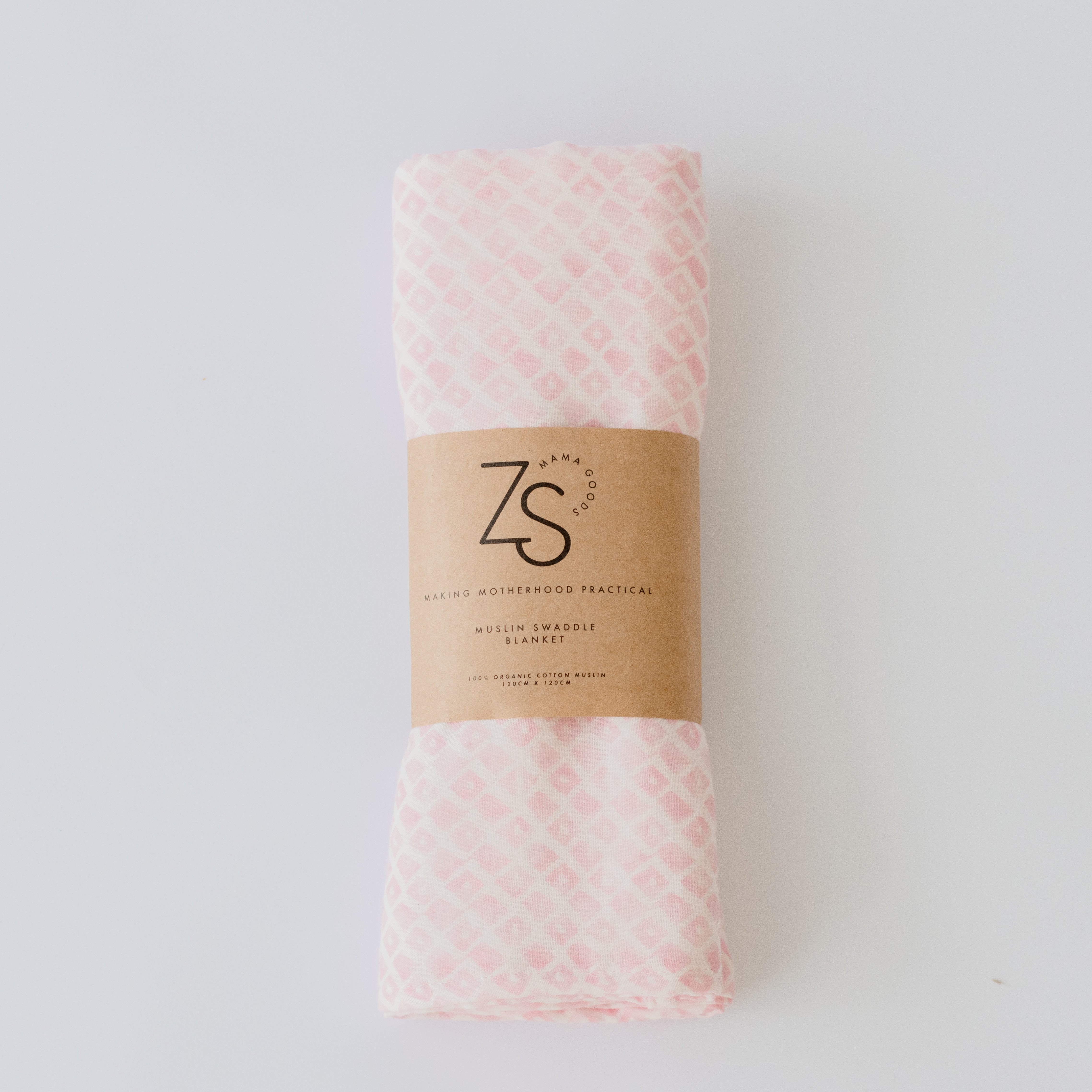 Organic cotton muslin swaddle wrap in rose geometry pattern folded display