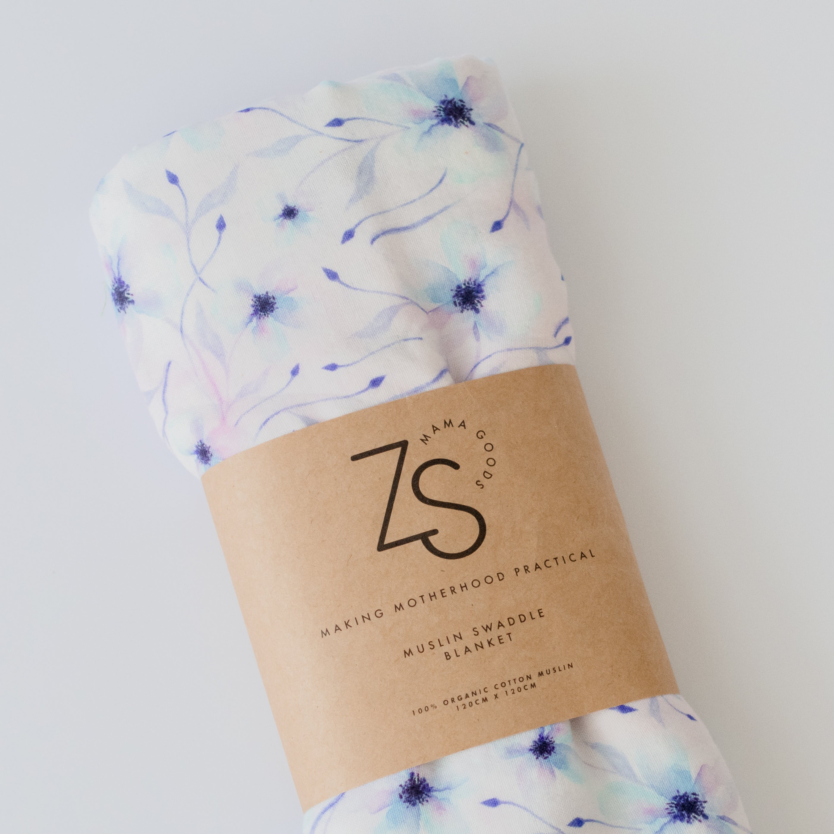 Organic cotton muslin swaddle wrap in twilight bloom floral print, folded display