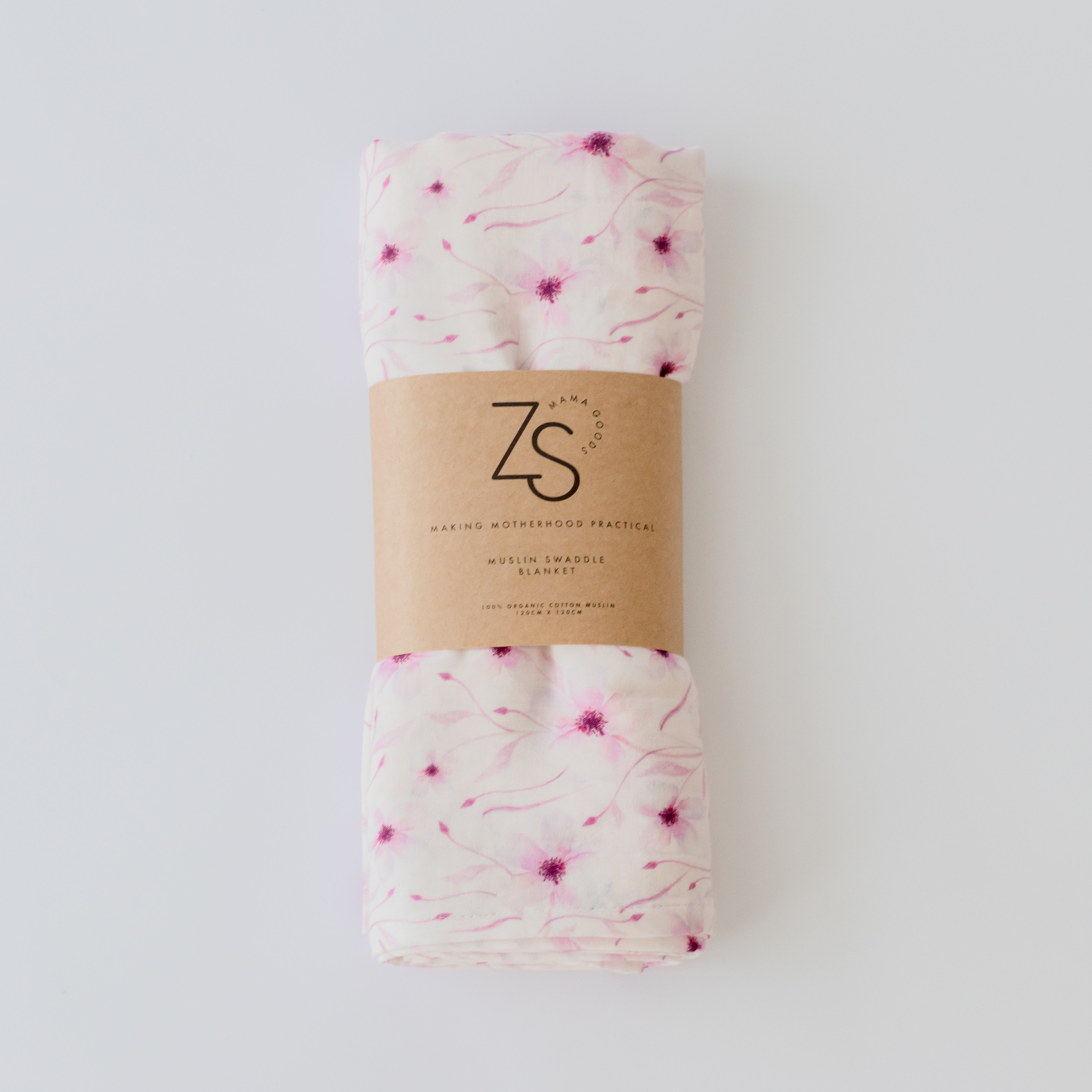 Organic cotton muslin swaddle wrap in blushing vine pattern displayed flat