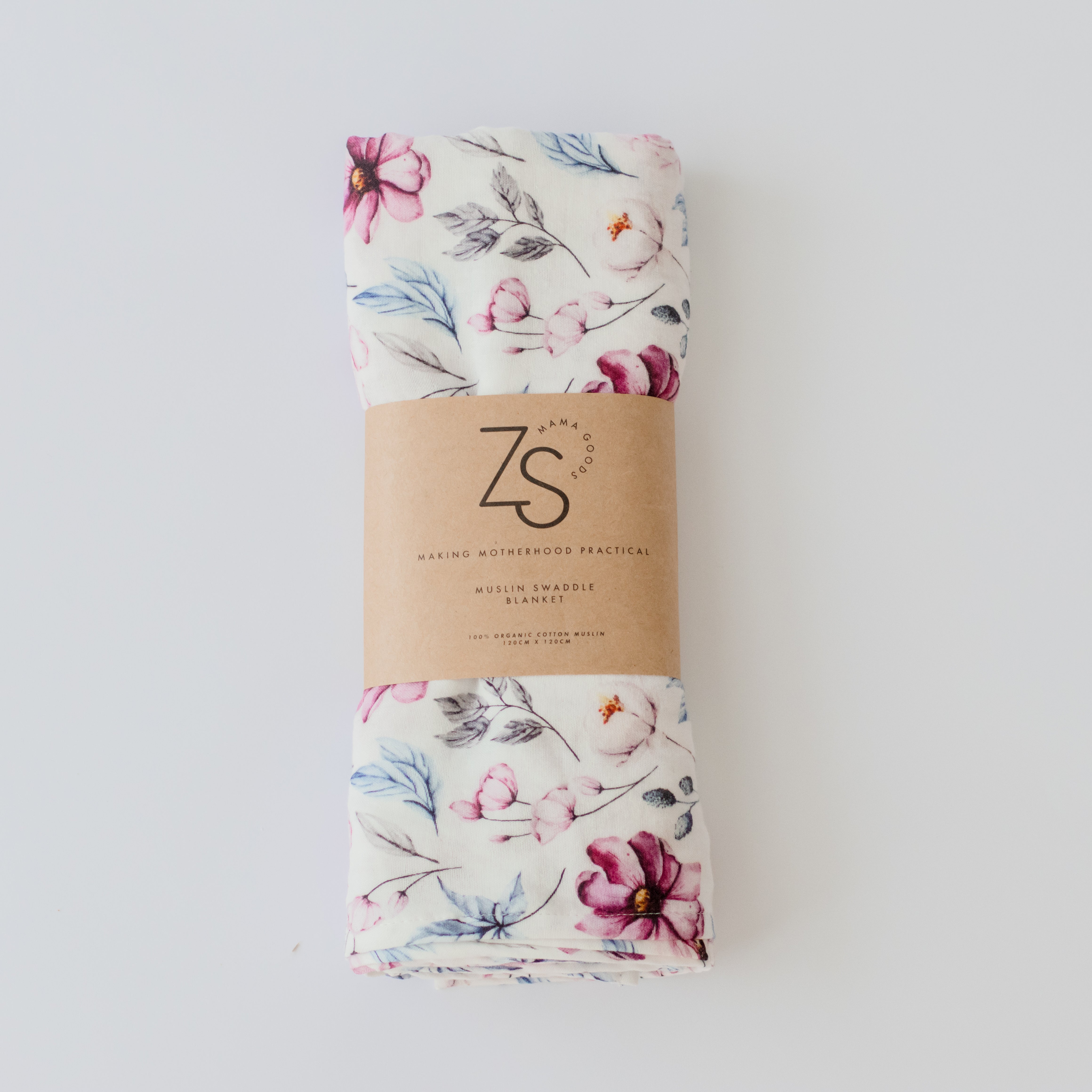 Organic cotton muslin swaddle wrap in soft blush pink folded display