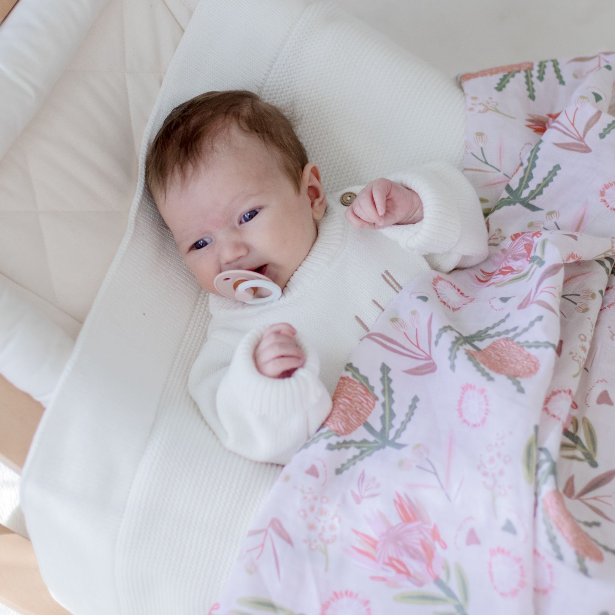 Soft organic cotton muslin wrap featuring delicate gumnut blossom print design