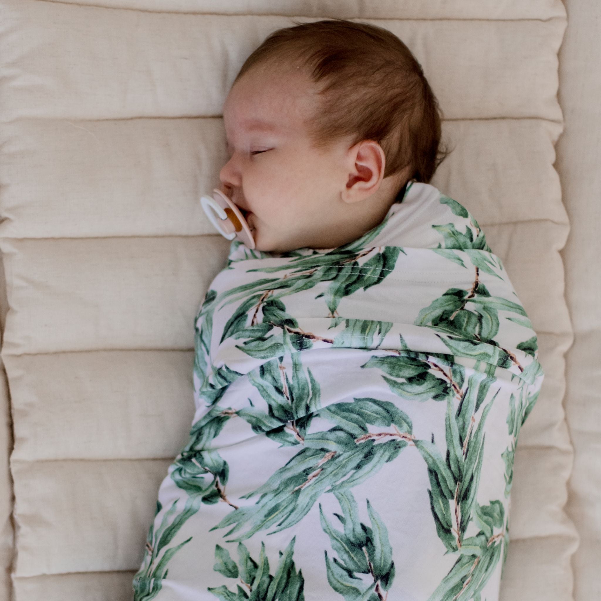 Blue gum leaf stretchy swaddle wrap folded showing soft fabric texture