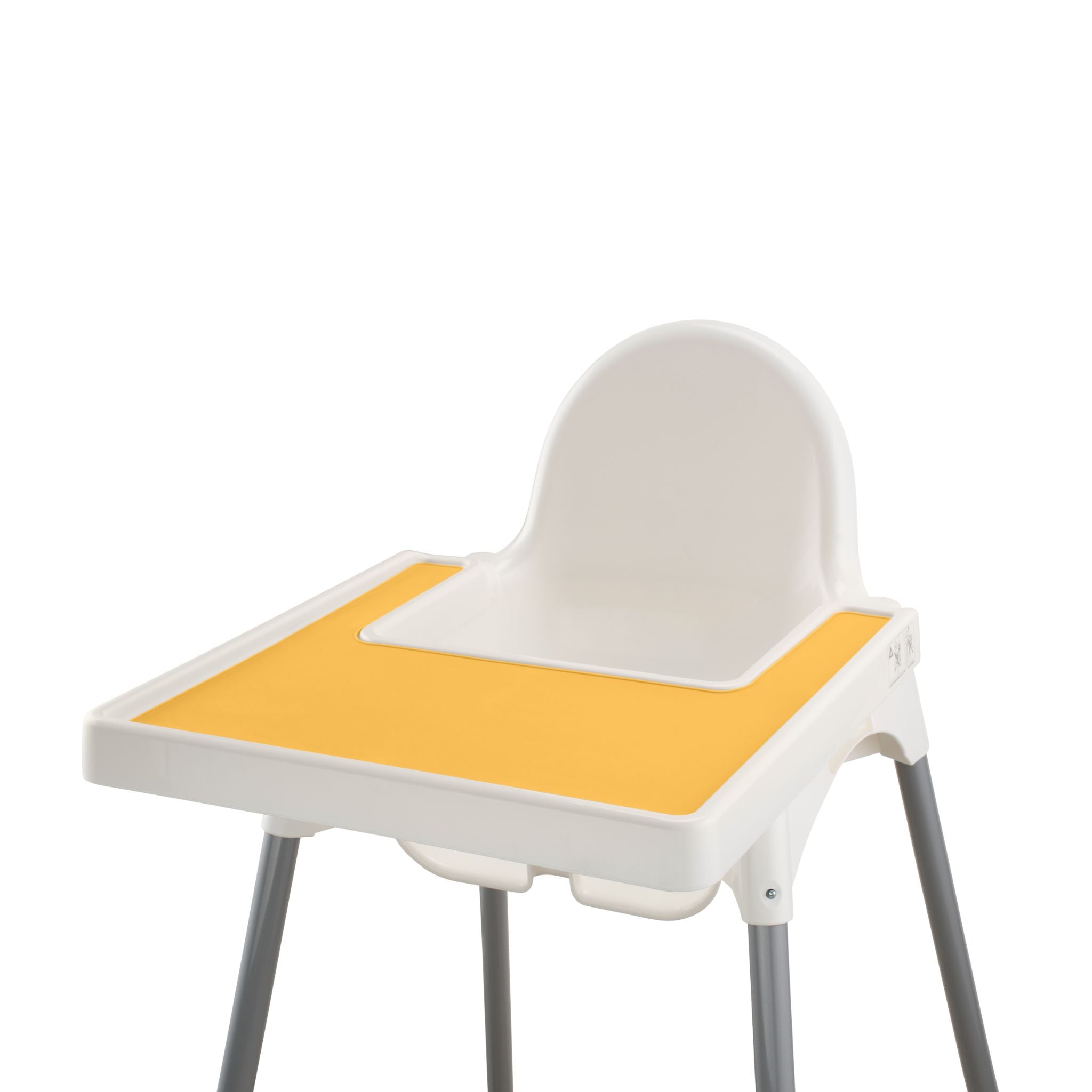 Yellow silicone placemat attached to wooden highchair tray with food