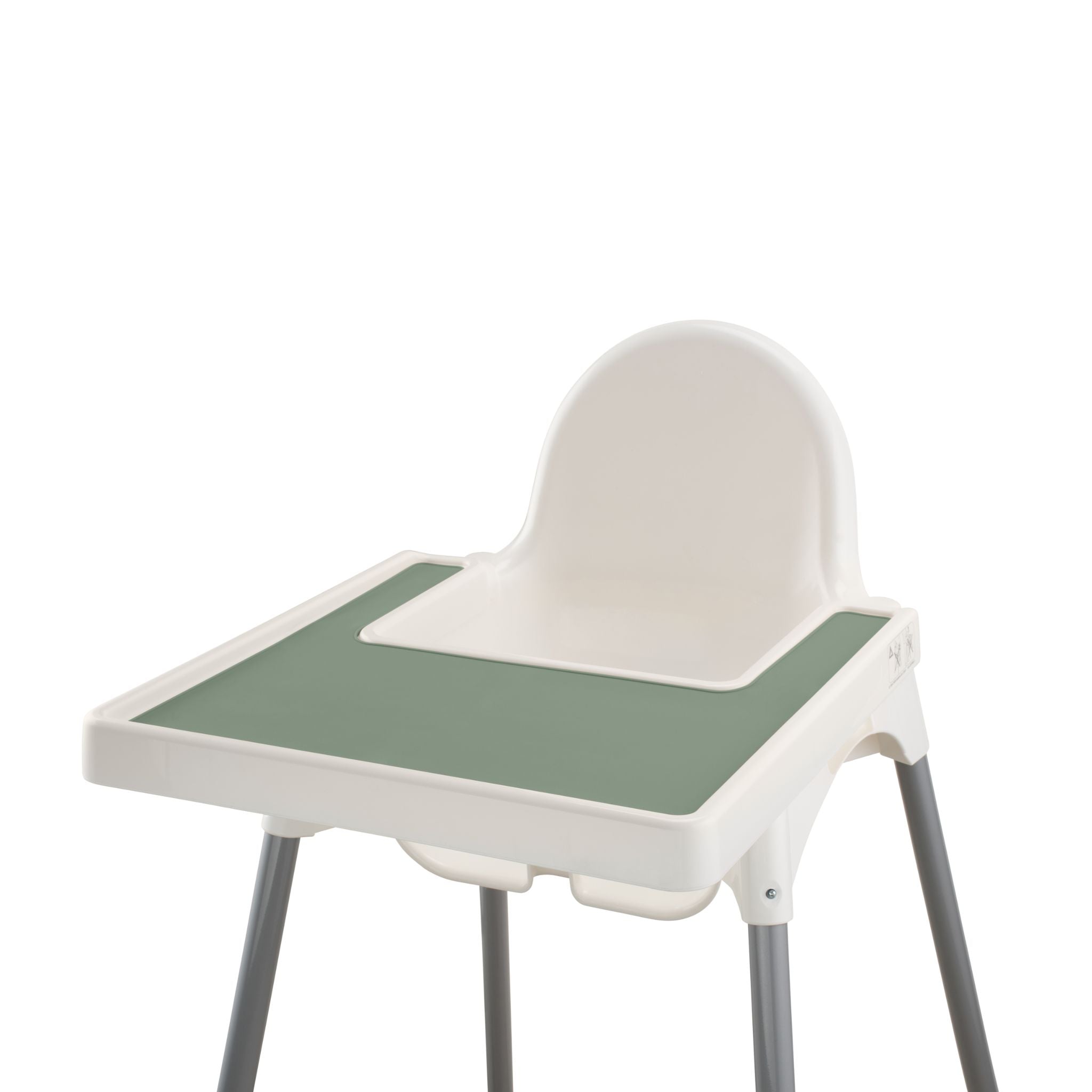 Silicone placemat in green attached to white highchair tray