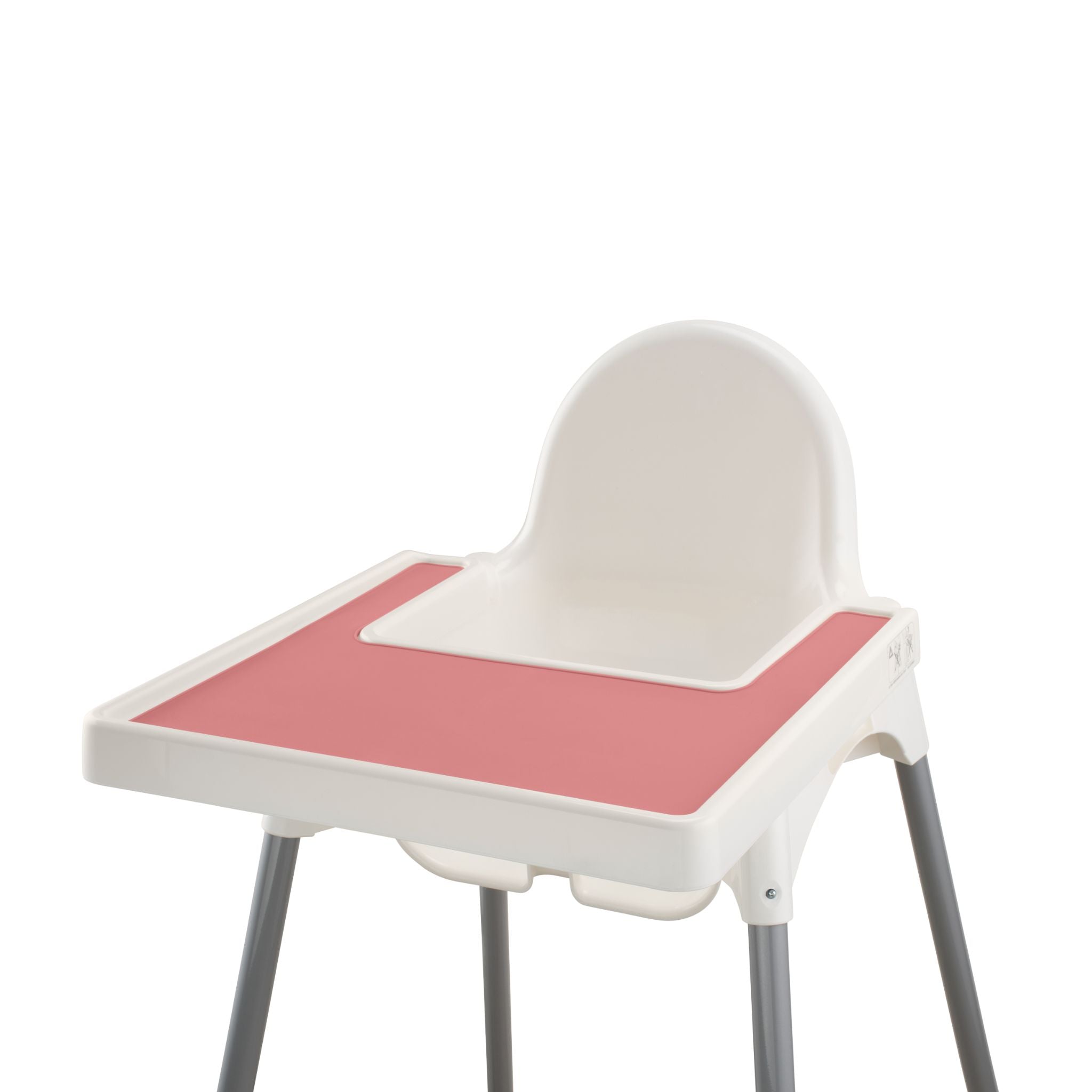 Pink silicone placemat attached to IKEA highchair with food on surface.
