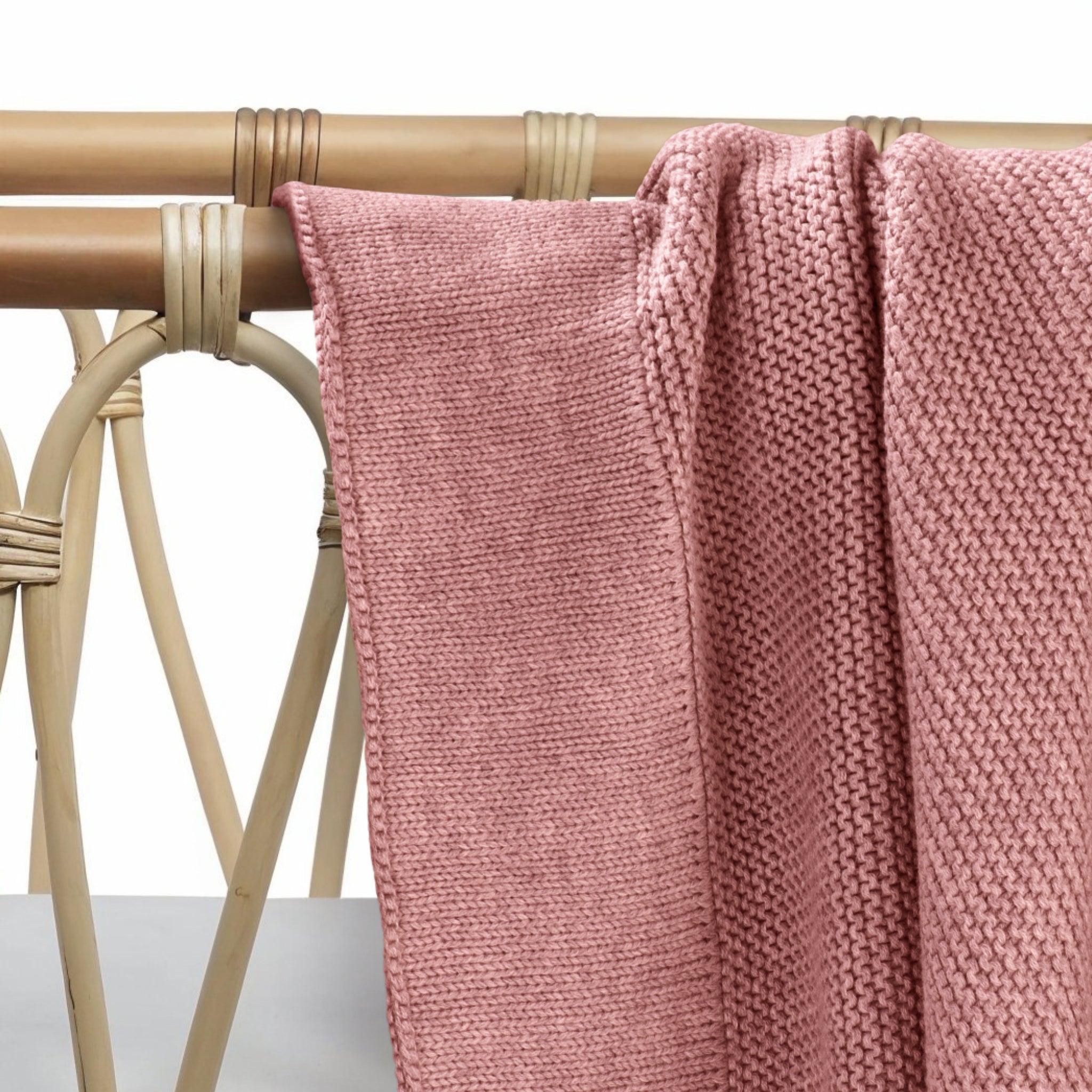 Plum cotton knit baby blanket folded and displayed showing soft texture