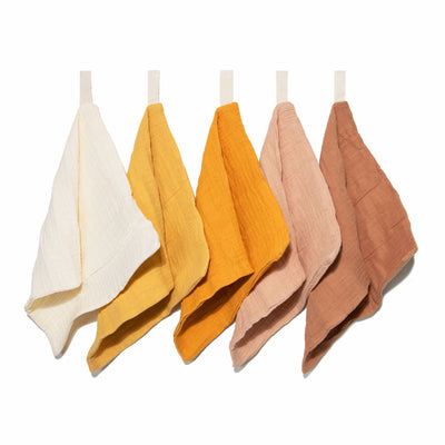Five soft organic muslin wash cloths in golden harvest tone by Zoe Sage