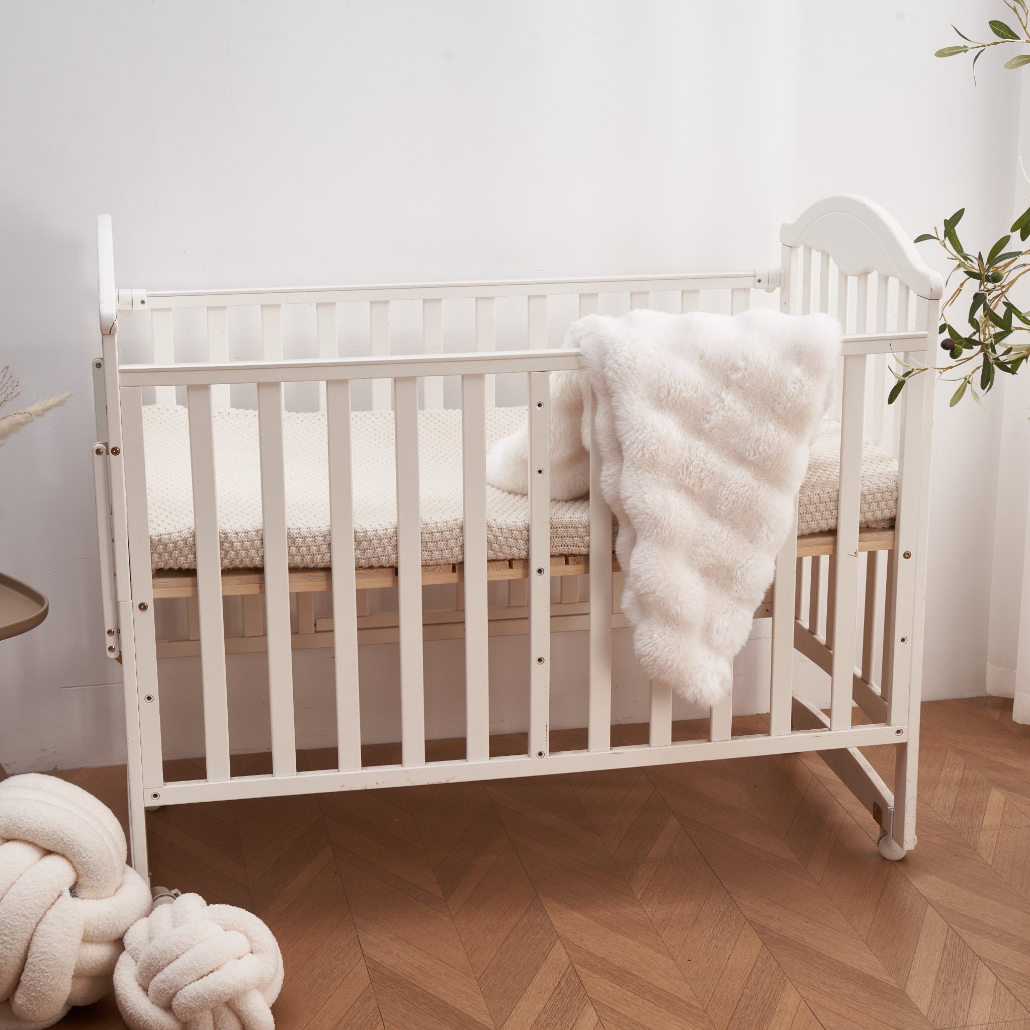 Ivory Cloud Bubble baby blanket draped softly showing texture and weave detail