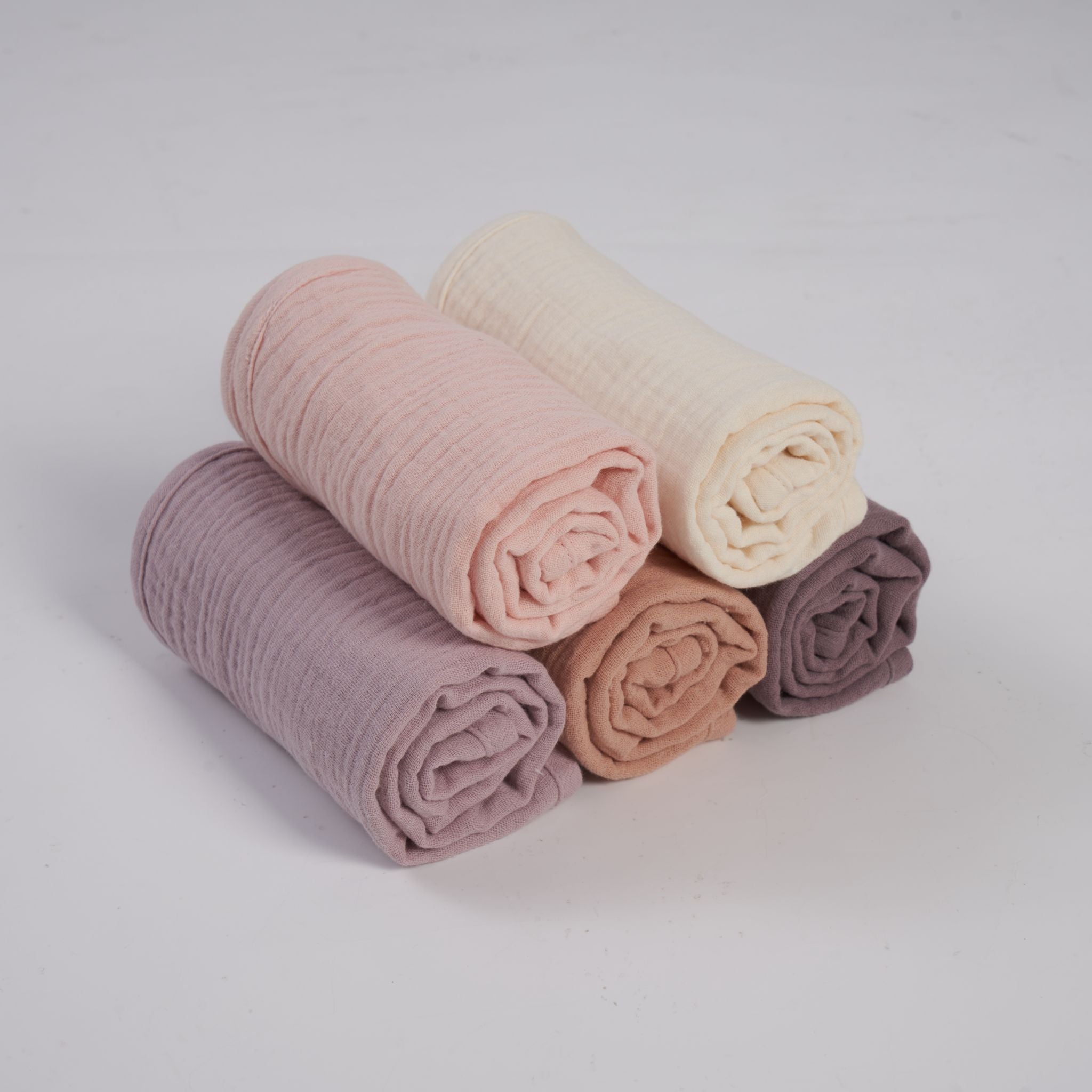 Five organic muslin burp cloths in soft lavender blush by Zoe Sage