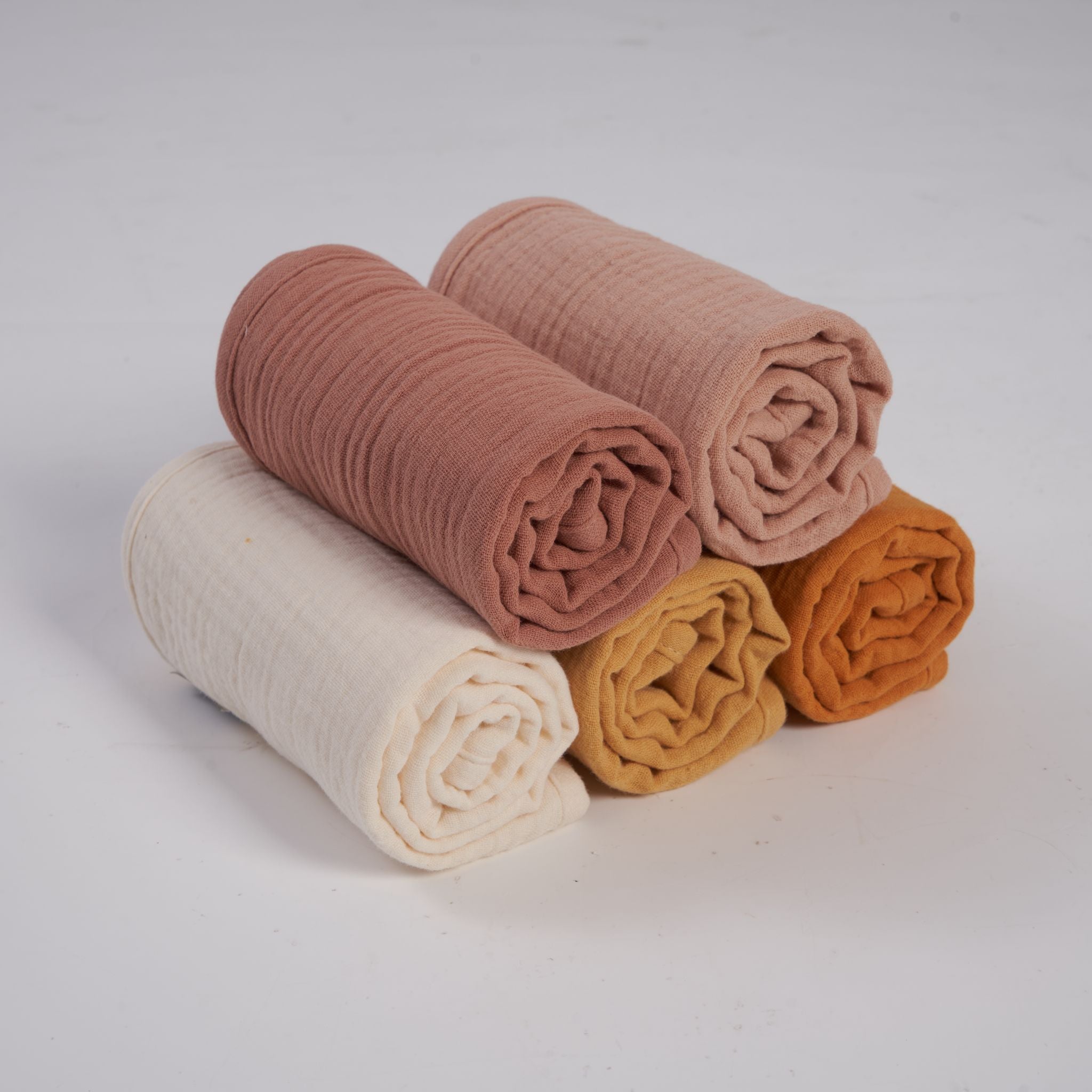 Organic muslin burp cloths in golden harvest tones from Zoe Sage