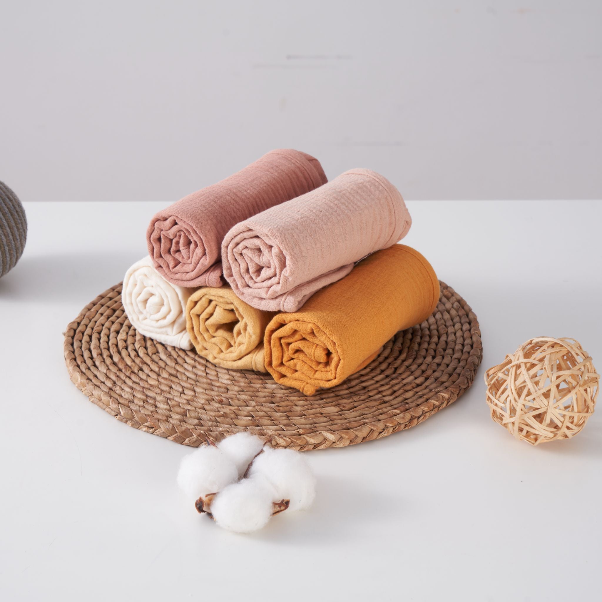 Organic muslin burp cloths in golden harvest color, five pack displayed together