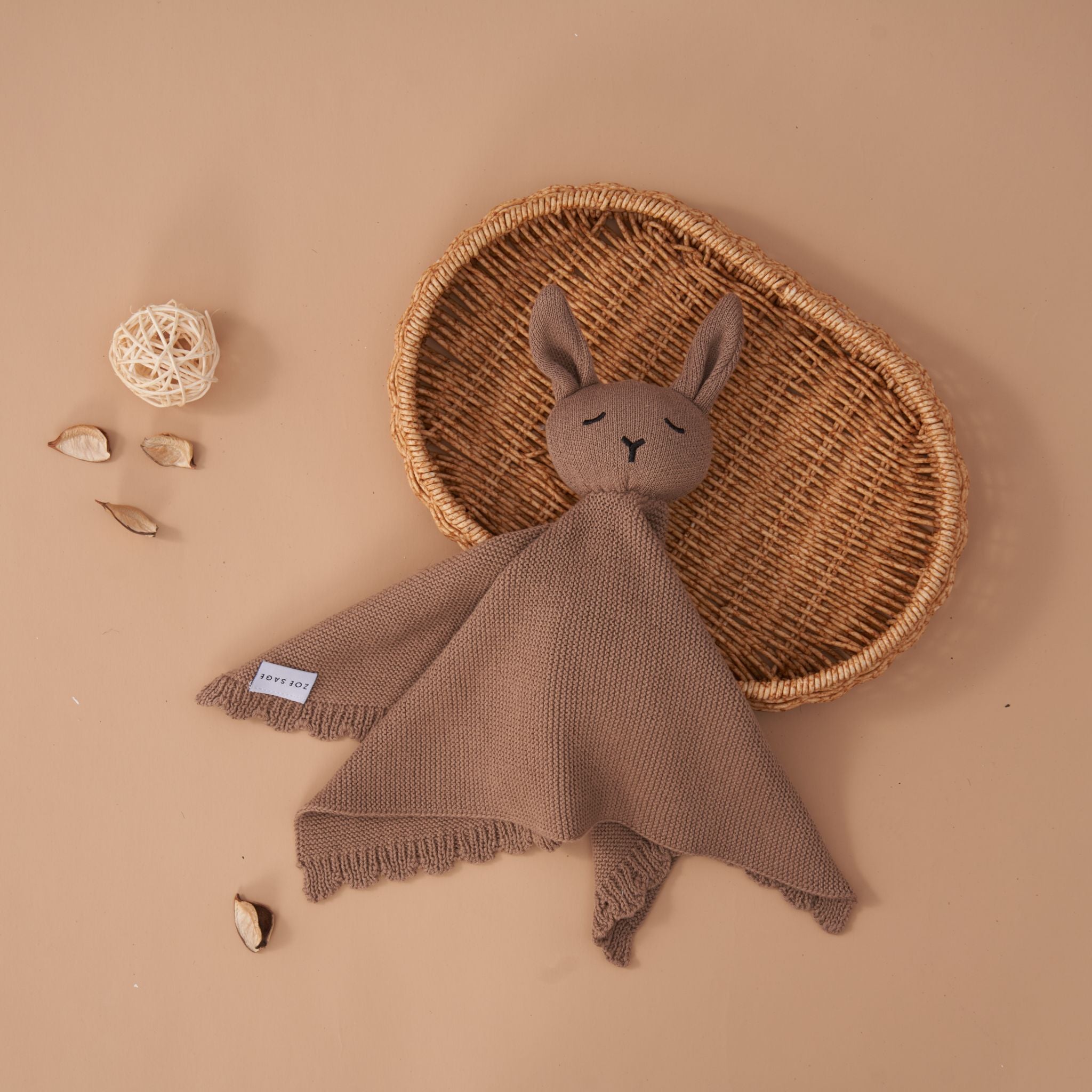 Mocha knitted lovey comforter in soft organic cotton packaging detail