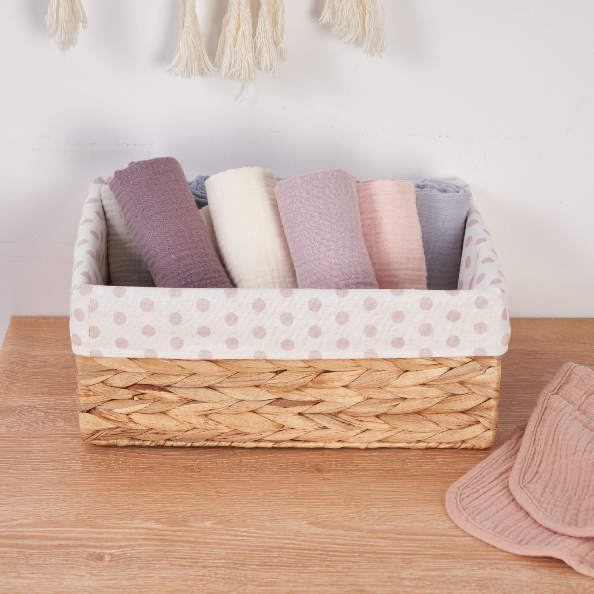 Lavender blush organic muslin burp cloths five pack folded display.