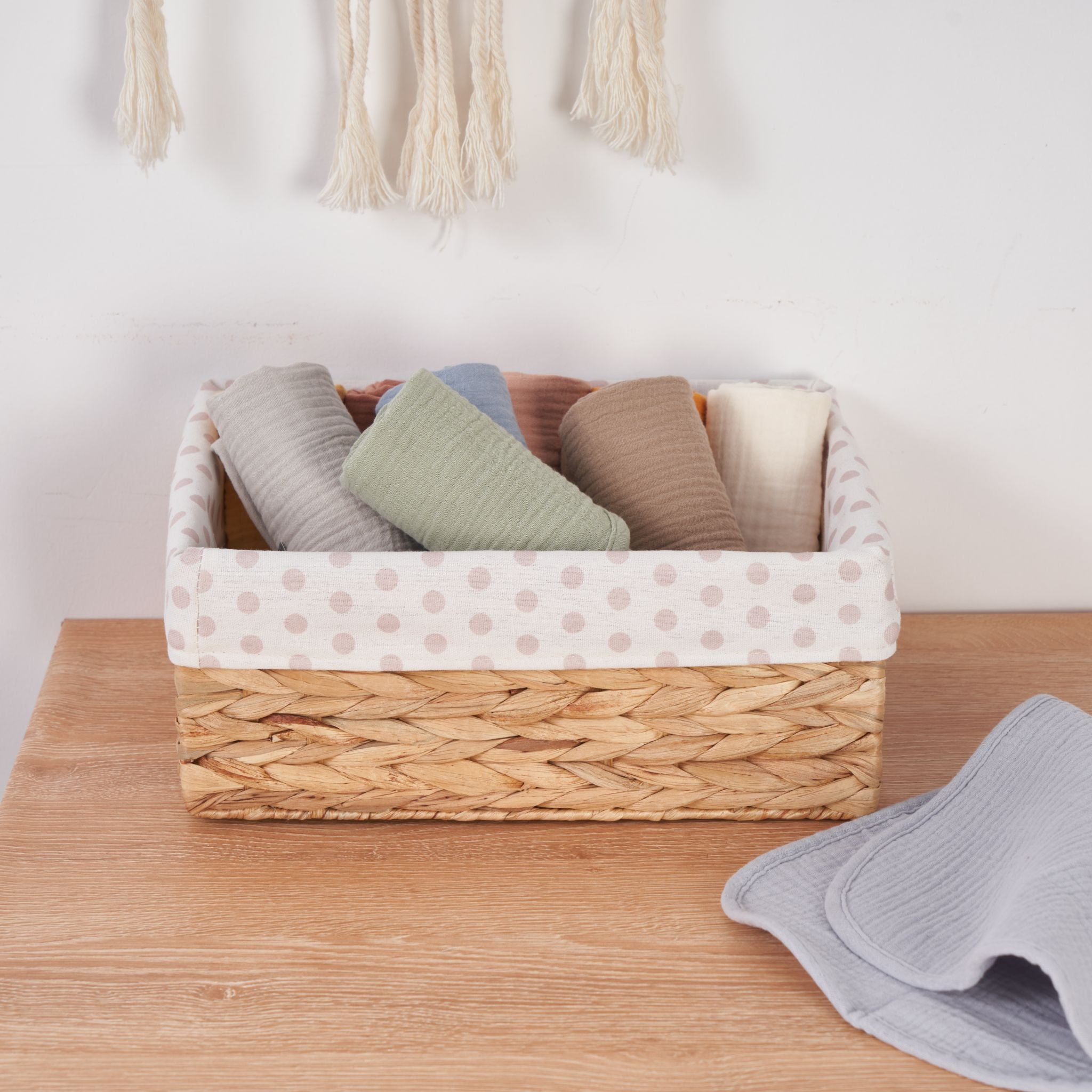 Five pack of organic muslin burp cloths in earth and sky colour tones.