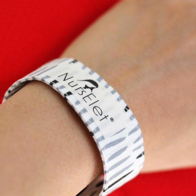Midnight Meadow nursing bracelet with beads worn on wrist for breastfeeding reminder