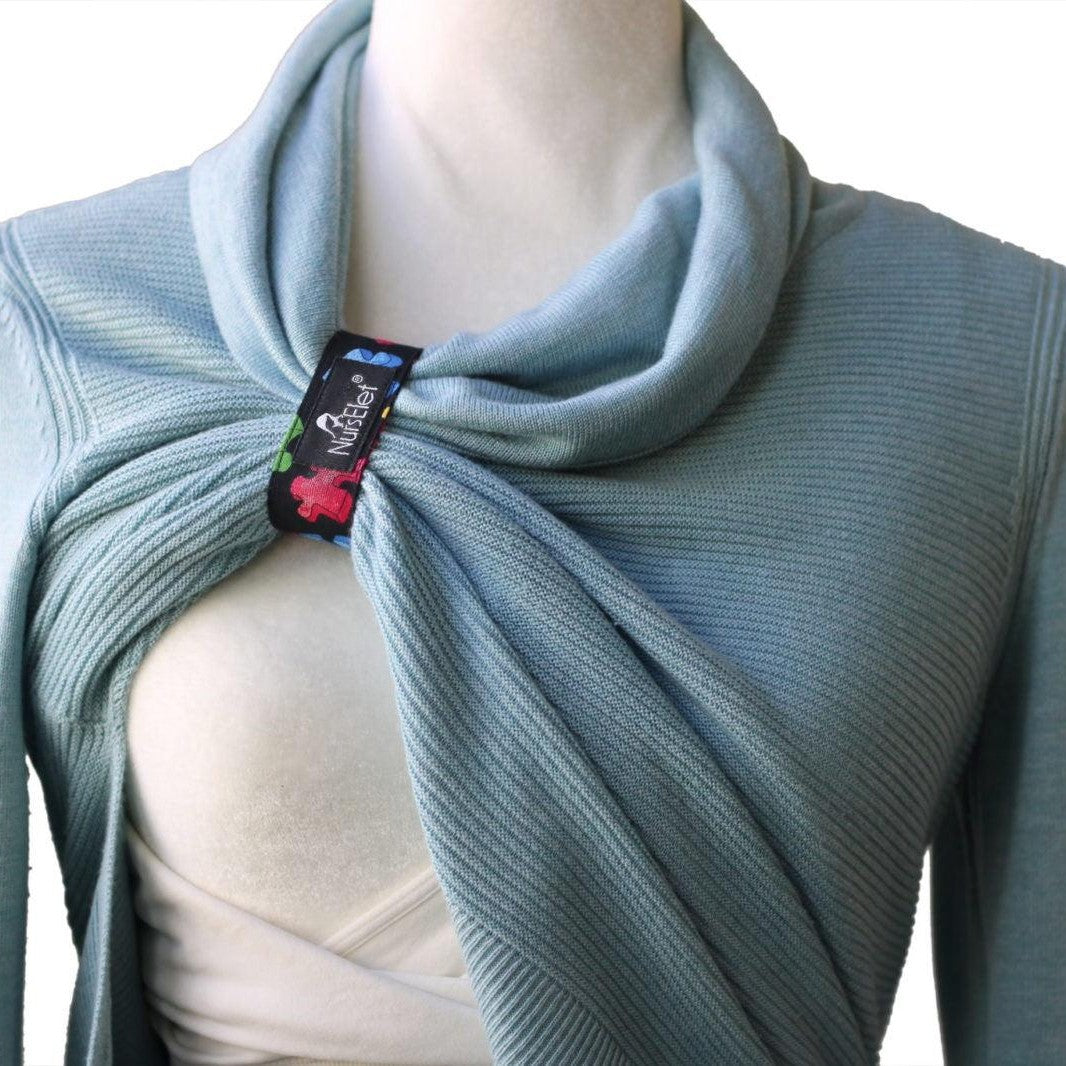 Wooden nursing bracelet with beads displayed as a breastfeeding reminder tool