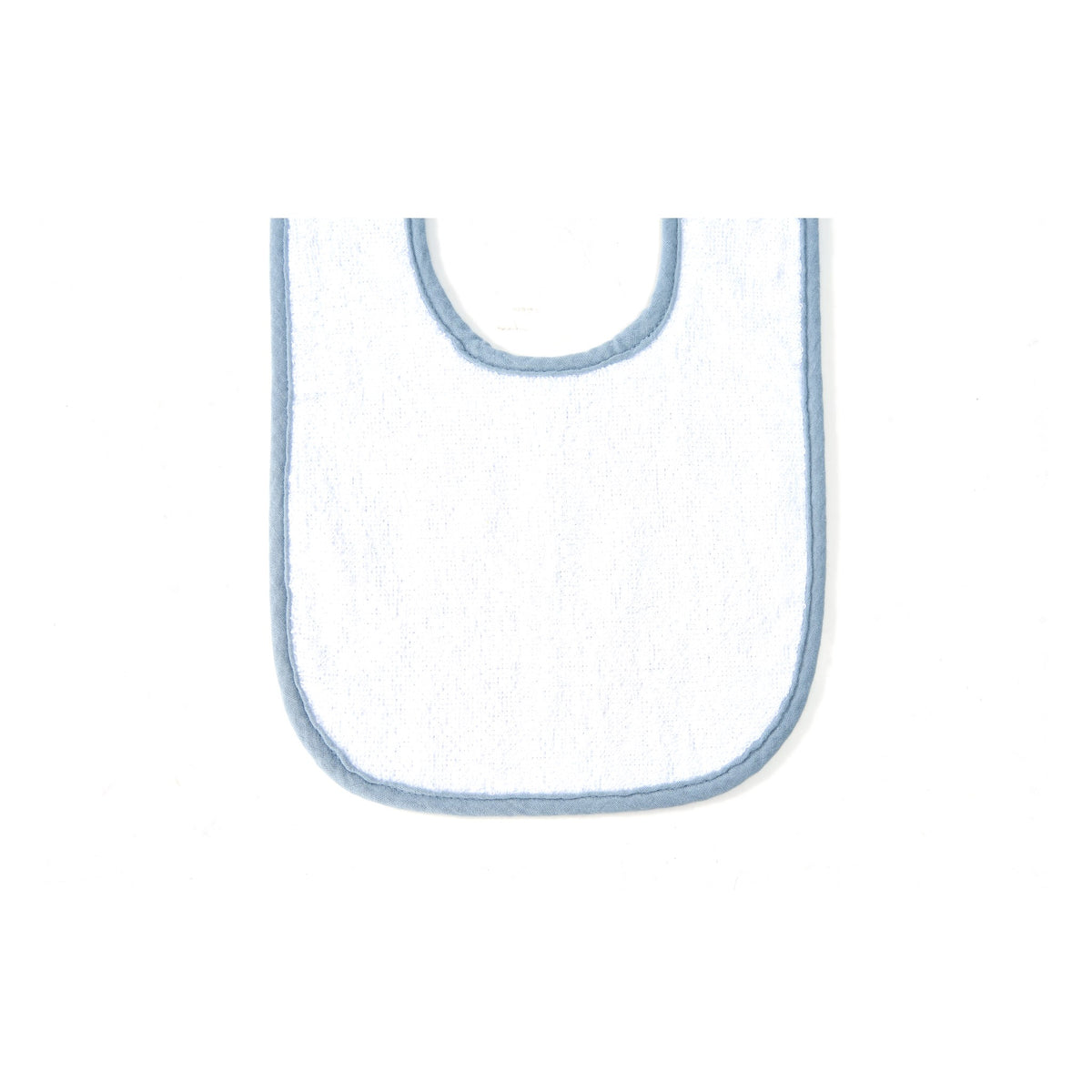 Back of a muslin baby bib showing the soft white terry towelling and adjustable snaps
