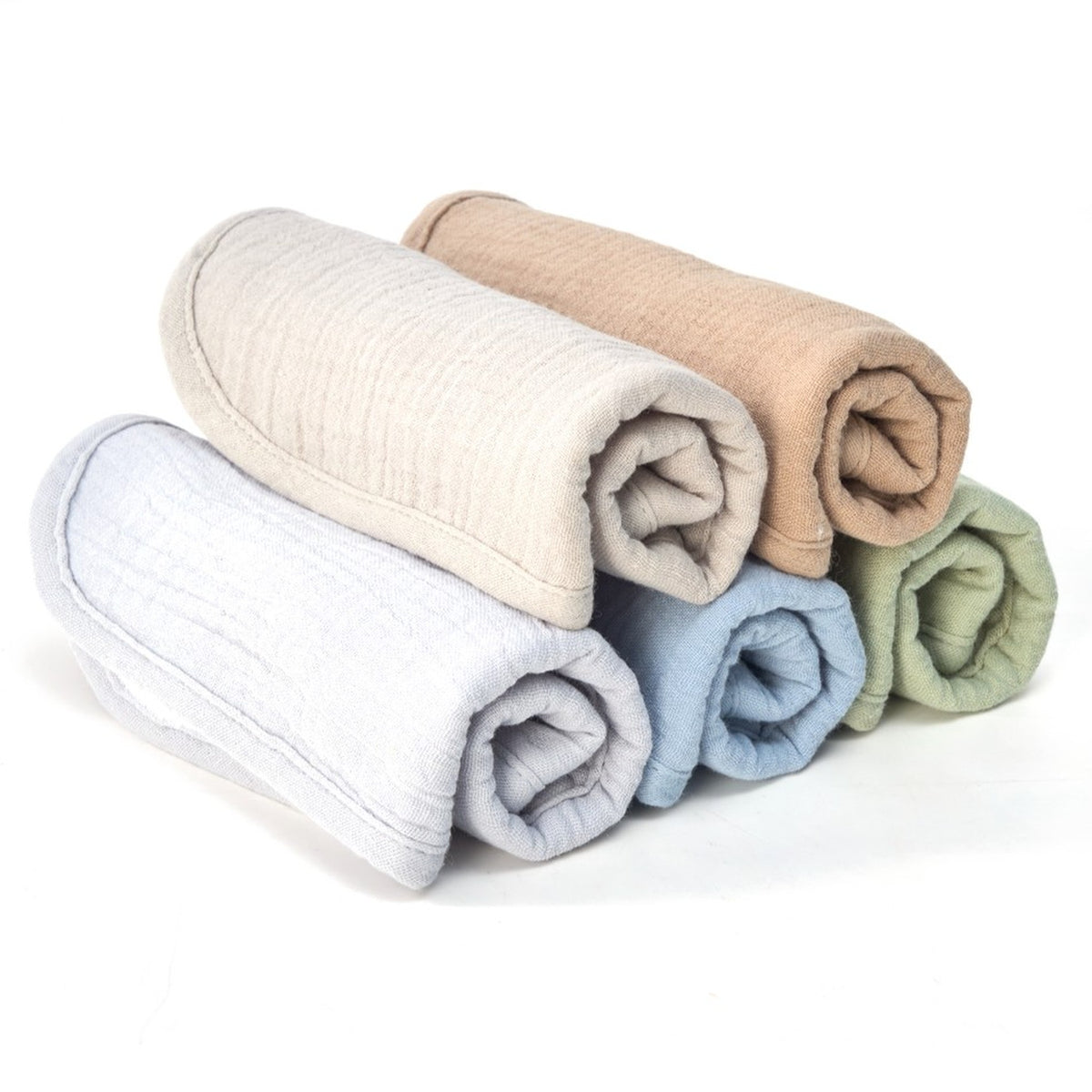 Five organic muslin baby bibs rolled and stacked in Earth and Sky colours