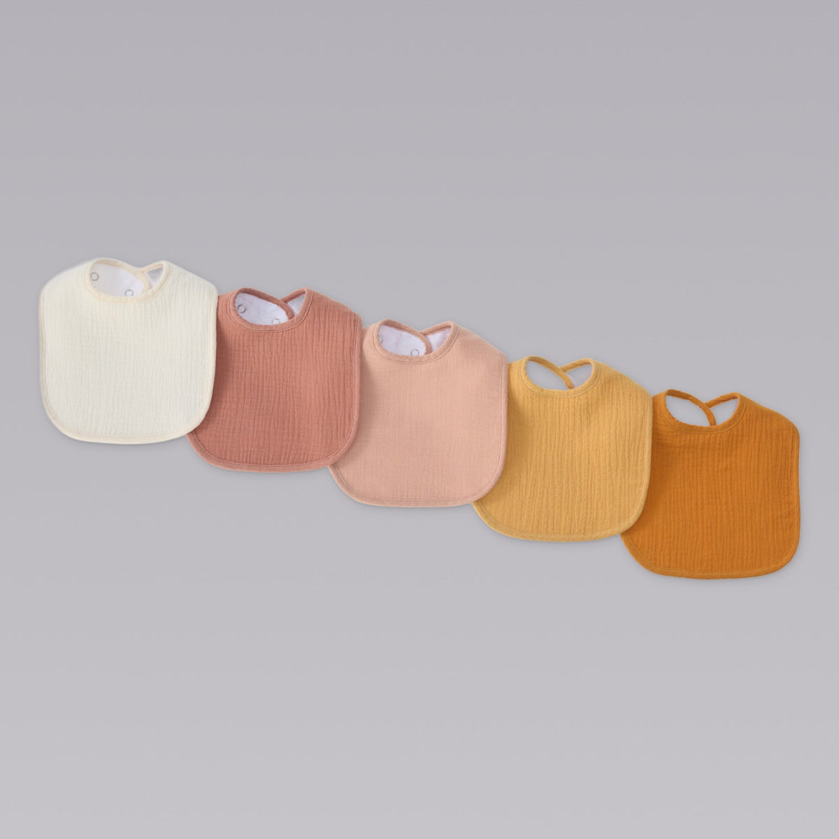 Organic muslin bibs in Golden Harvest