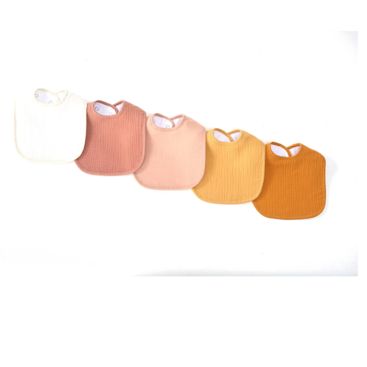 Organic muslin baby bibs in golden harvest tones by Zoe Sage, five pack colour fan