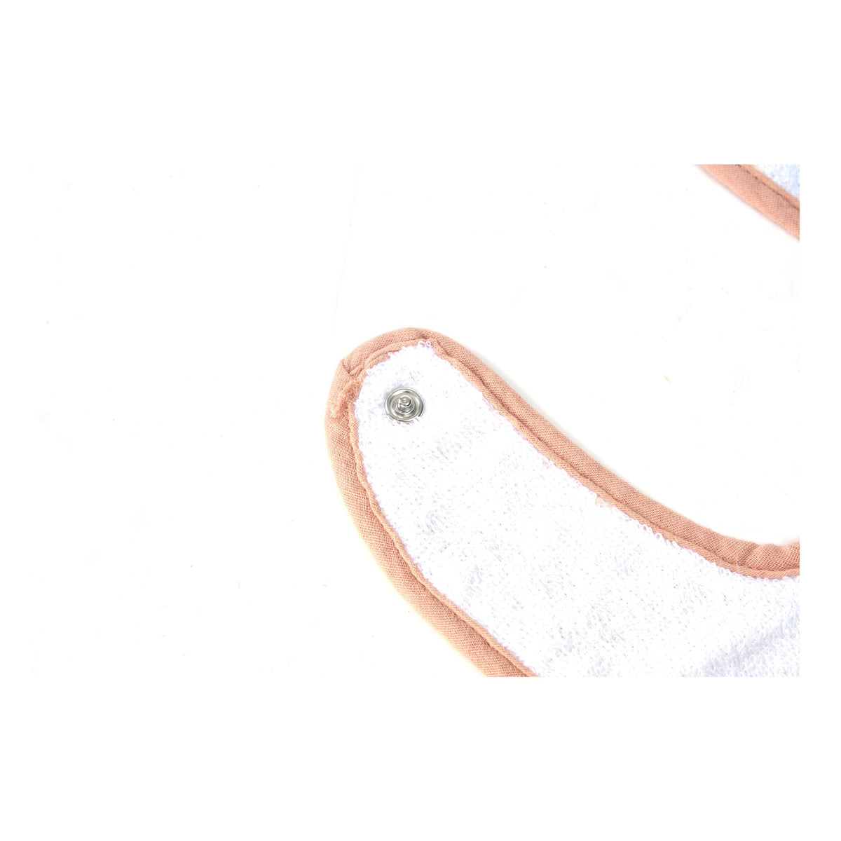 Close up of the press stud fastening on a Zoe Sage muslin baby bib