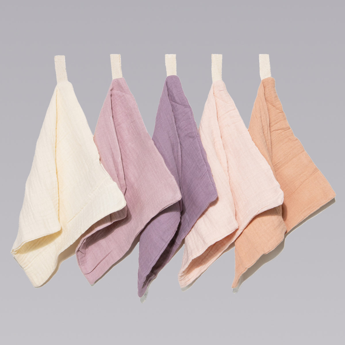 Five soft organic muslin baby wash cloths in lavender blush by Zoe Sage