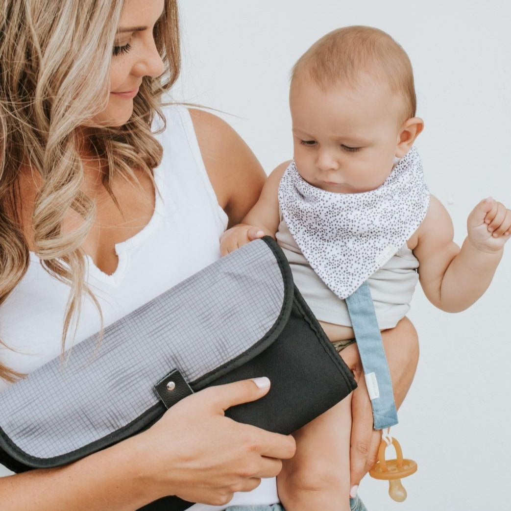 Portable nappy change clutch in gridlock grey folded packaging detail