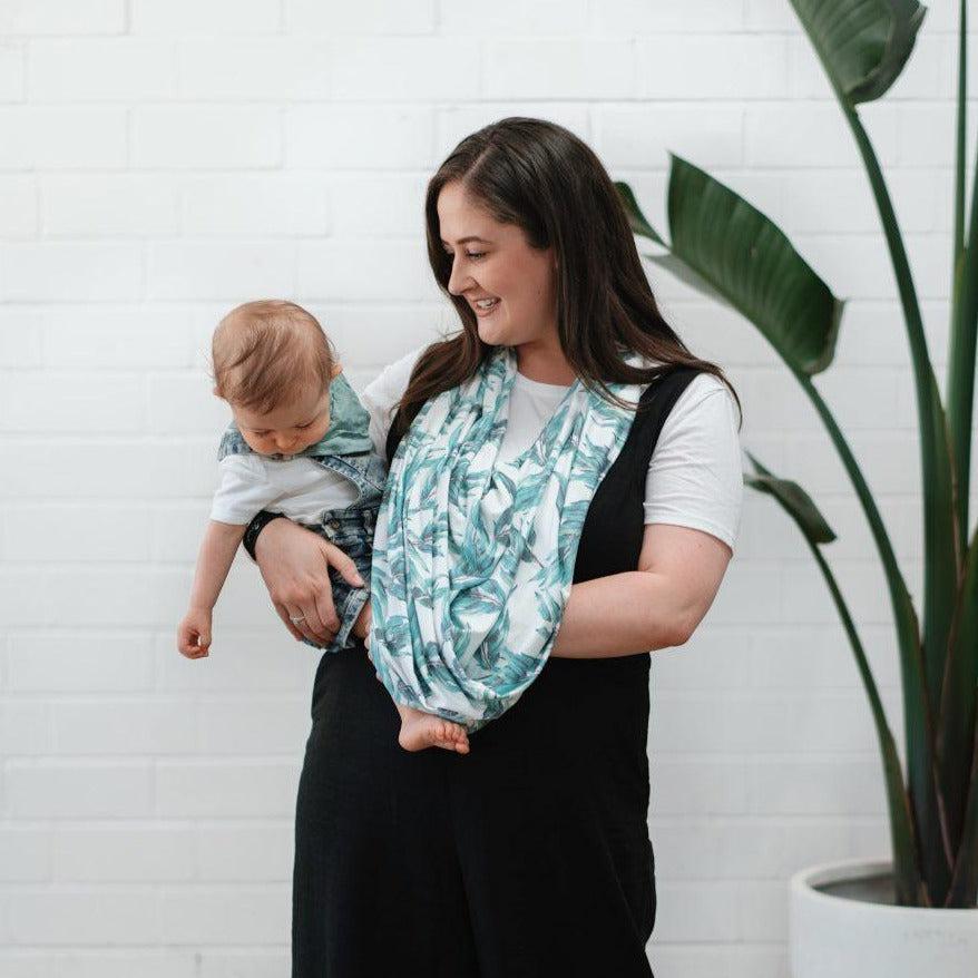Blue gum leaf nursing cover draped over shoulder for breastfeeding
