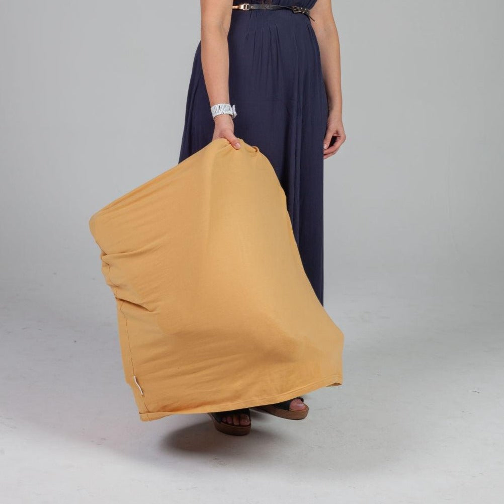 Women carrying a baby carrier in dull peach color